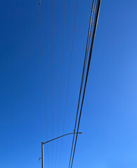Electricity powerlines under blue sky