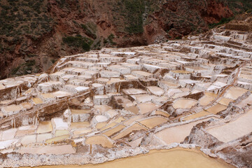 Salt evaporation ponds in Maras salt mines in Cusco city the Sacred Valley, Peru