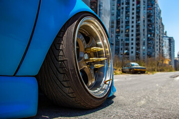 Front wheel of a tuning car on a city street