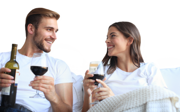 Young loving couple drinking a glass of red wine in their living room on a transparent background