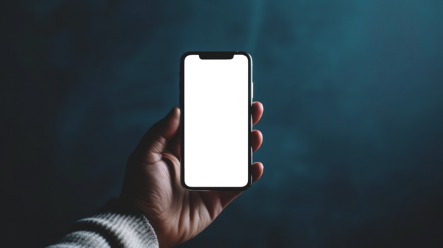 A hand holding an Smartphone with transparent screen, blurred background, closeup shot of the phone.
