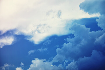 High clouds in the summer sky. Sky background. Meteorological observations of the sky.