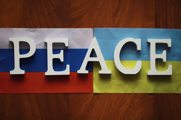 Peace Word Written In Wooden Letters. International conflict, American hegemony, War. Ukraine and...