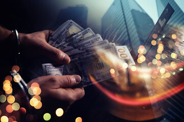  Double exposure city and hands of a man with handcuffs on a background of us dollars. Fraud, cyber...