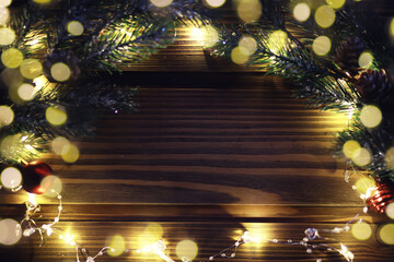 Christmas and New Year wooden background with light. Border art design with Christmas tree