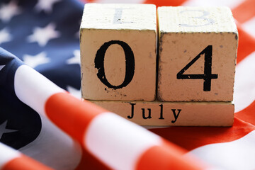 July 4th wooden Stars and Stripes flag on background with flag of the USA. Summer day. Independence...