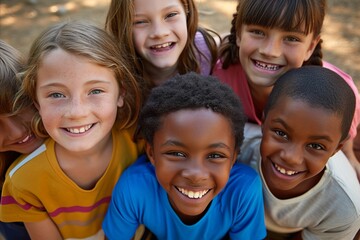 Portrait of group of children smiling and looking at camera in park