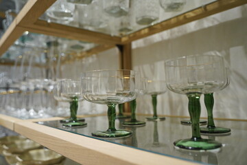 Glassware is displayed on the shelf