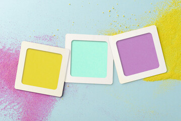 Three blank  frames in yellow, blue, and purple textured background sprinkled with colorful sand. Ideal for creative designs