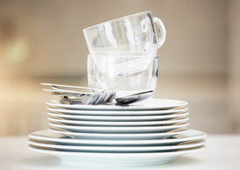 Stack, clean dishes and cups with cutlery for catering, household and tableware for dinner meal at...