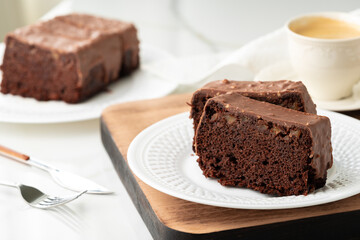 Fresh homemade chocolate sponge cake on wooden board