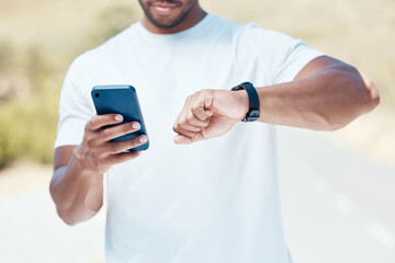 Man, hands and time with phone or fitness watch in nature for tracking performance or workout schedule. Closeup of male person, runner or athlete checking wristwatch for monitoring outdoor exercise