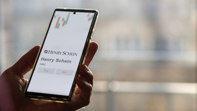 April 09th 2024 , Melville, New York. Close up on logo of Henry Schein on the screen of an exchange. Henry Schein price stocks, $HSIC on a device.
