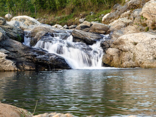 Fototapeta na wymiar waterfall in the mountain's river