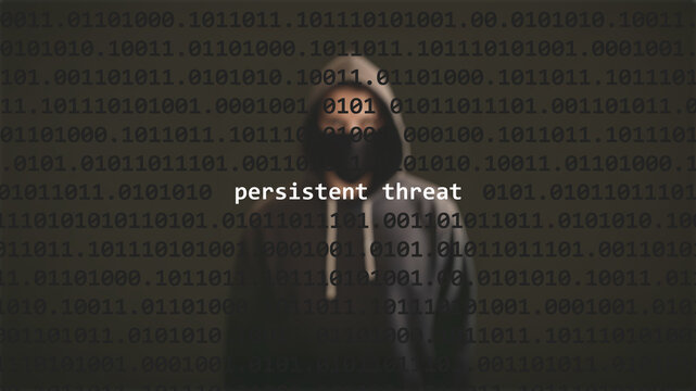 Cyber attack persistent threat text in foreground screen, anonymous hacker hidden with hoodie in the blurred background. Vulnerability text in binary system code on editor program.