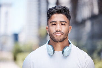 Man, portrait and headphones outdoor for fitness, music or audio streaming with personal trainer in...