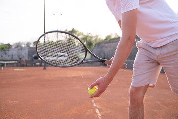 tennis player with racket on a serve