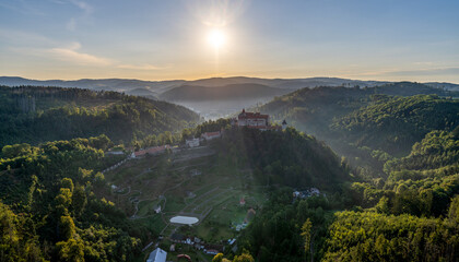 Morning sunrise aerial shot of Pernštejn castle in czech republic
