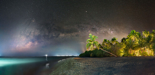 Milky way over beach on tropical island in Maldives