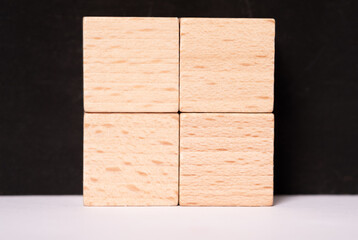 Four empty wooden cubes with place for letters or images - obrazy, fototapety, plakaty