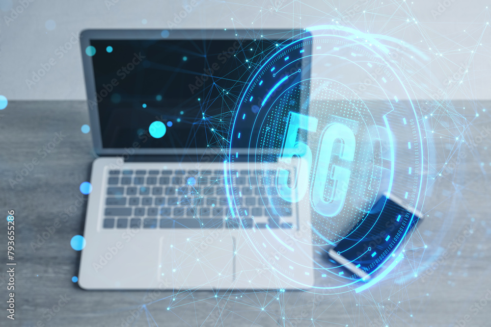 Poster close up of laptop and smartphone on toned desk with creative glowing polygonal 5g hologram on blurr