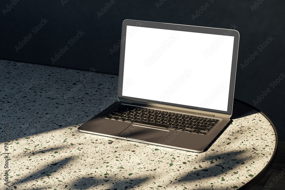 Poster Close up of modern designer desktop with empty white mock up laptop on marble desk, sunlight and shadows. 3D Rendering.