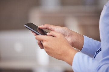 Business person, phone and text in an office with tech break, social media and website scroll. Company, technology and mobile message of a professional with online and digital news app of worker