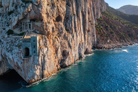 Porto Flavia mine on the rock aerial drone view in Sardinia, Italy