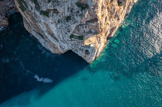 Porto Flavia mine on the rock aerial drone above view