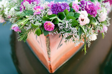 Vibrant floral arrangement on a boat's bow