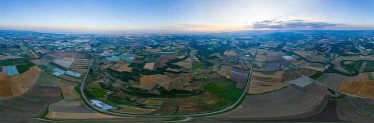 Ginosa, Italy. Geometric pattern of agricultural fields. Sunset time. Panorama 360. Aerial view