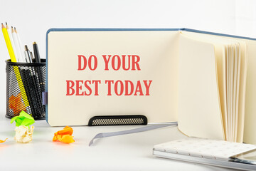 Business motivational. Do your best today symbol on a blank sheet of an open business notebook