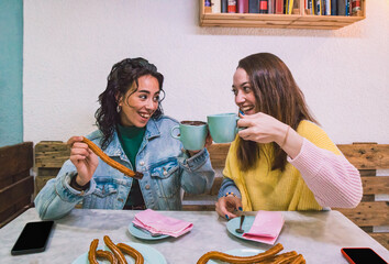 Friendly friends toast their reunion with a cup of chocolate. Lifestyles and food. - obrazy, fototapety, plakaty