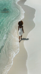 Serene Beach Walk: Woman Strolling by the Shoreline