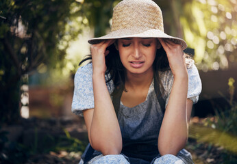 Woman, stress and garden with crying from sad news, depression and memories in home. Female person,...