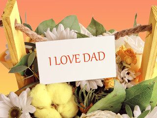 Happy fathers day, i love dad on a business card enclosed in flowers - obrazy, fototapety, plakaty