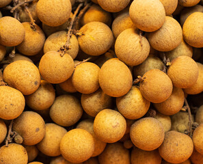 longan fruit in peel as background.