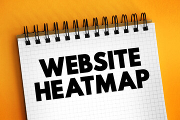 Obraz premium Website Heatmap is a behavior analytics tool that helps you understand how visitors interact with individual website pages, text concept on notepad