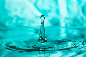 close-up shot of a bounce of a water droplet