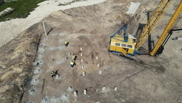 footage from a residential building drone. installation of piles by builders