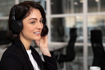Woman professional helpline call center agent in wireless headset - 793699616