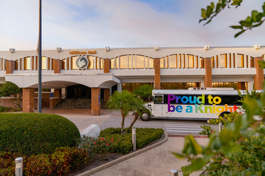 University of Central Florida campus in Orlando, Florida. Millican Hall, the administrative offices of UCF, during sunset with a UCF campus shuttle bus. Proud to be a Knight.