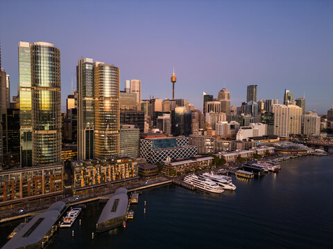 Sydney, Australia: Aerial view ferry waits at the Barangaroo Wharf in the Darling Harbor newly redeveloped district in downtown Sydney at sunset.