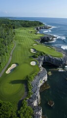 Picturesque golf course on white cliffs with iconic rock arches overlooking the stunning blue sea