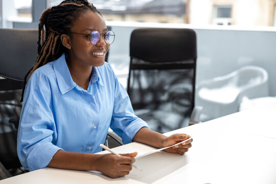 Adult beautiful joyful woman smiling while working