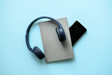Headphones with Book and Smartphone Audiobook Setup