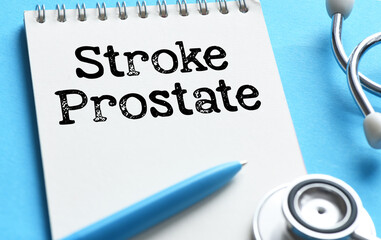 Stroke prostate words on a notebook next to a stethoscope.