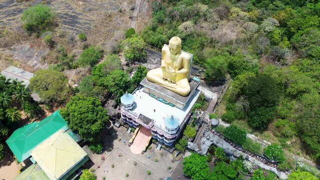 Aerial drone landscape view of Golden Buddha statue Dambulla cave temple building Spiritual Religion in Sri Lanka Asia travel tourism