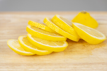 Lemon slices on a wooden cutting board