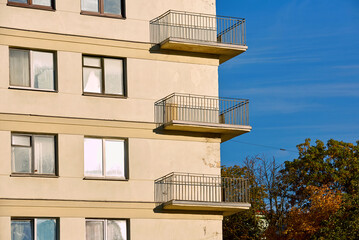 Сantilevered balconies on facade of old residential building. Cantilevered balcony type on the corner of buidling. Soviet architecture